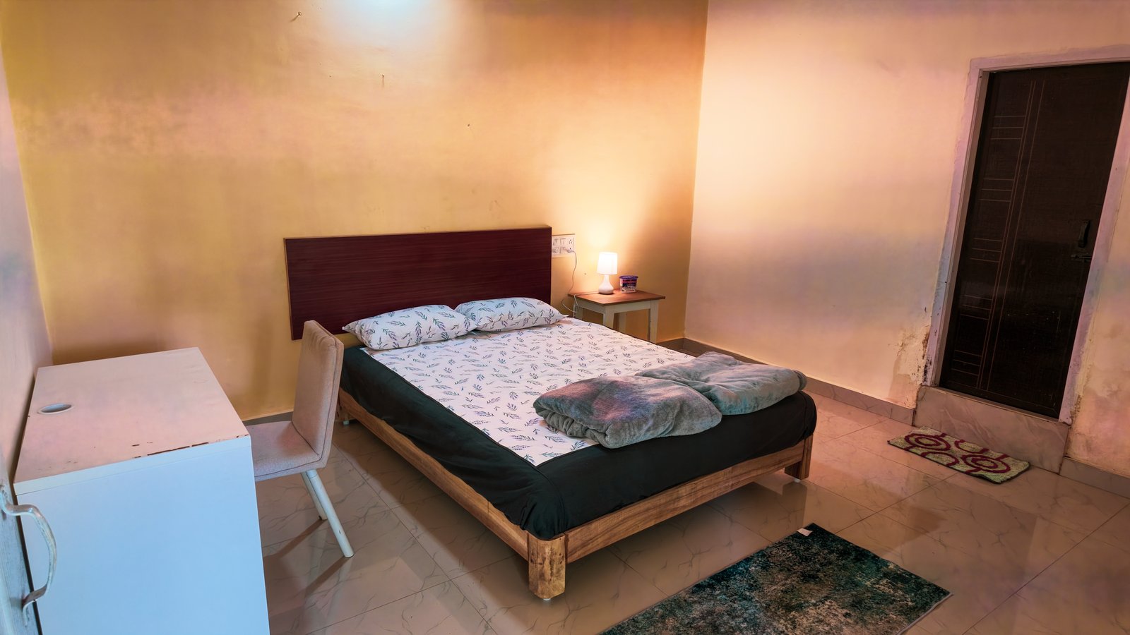 Room with wardrobe and sitting area